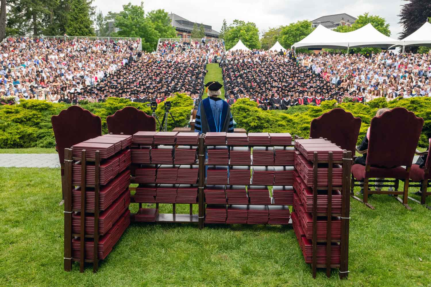 view from behind the speaker at an outdoor commencement ceremony on Vassar campus