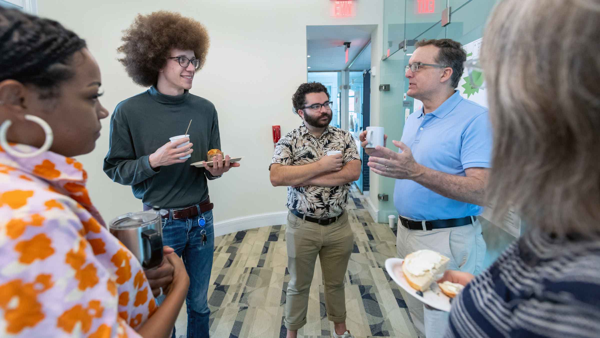 A group of people standing and talking