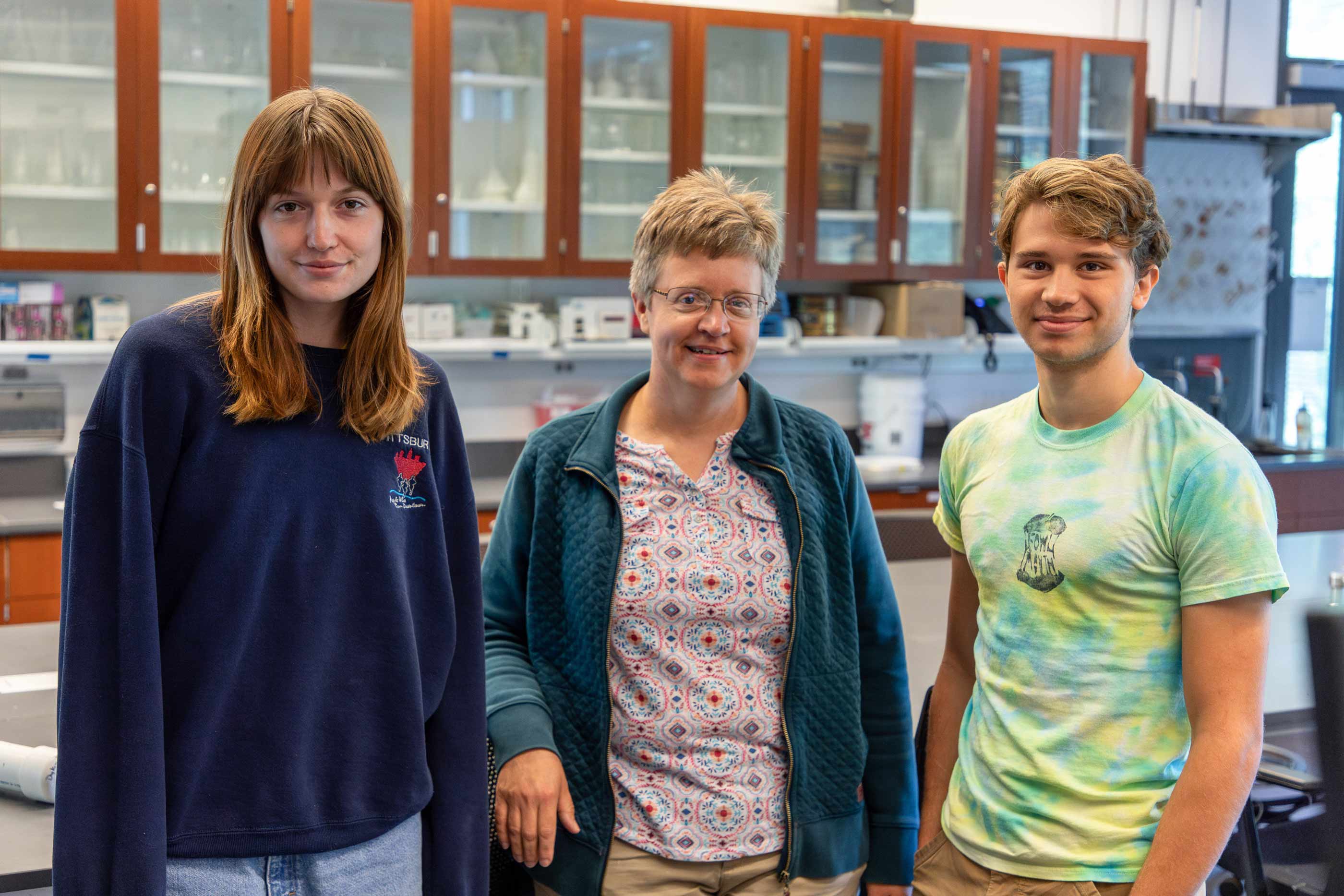 Ava Casalino ’24 and Ezra Potts ’25 posing with Professor of Earth Science Kirsten Menking.