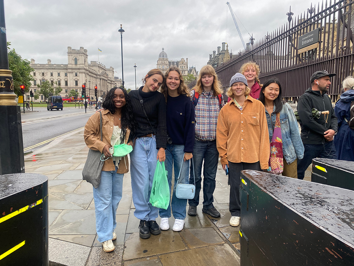 Group of people standing on sidewalk in London