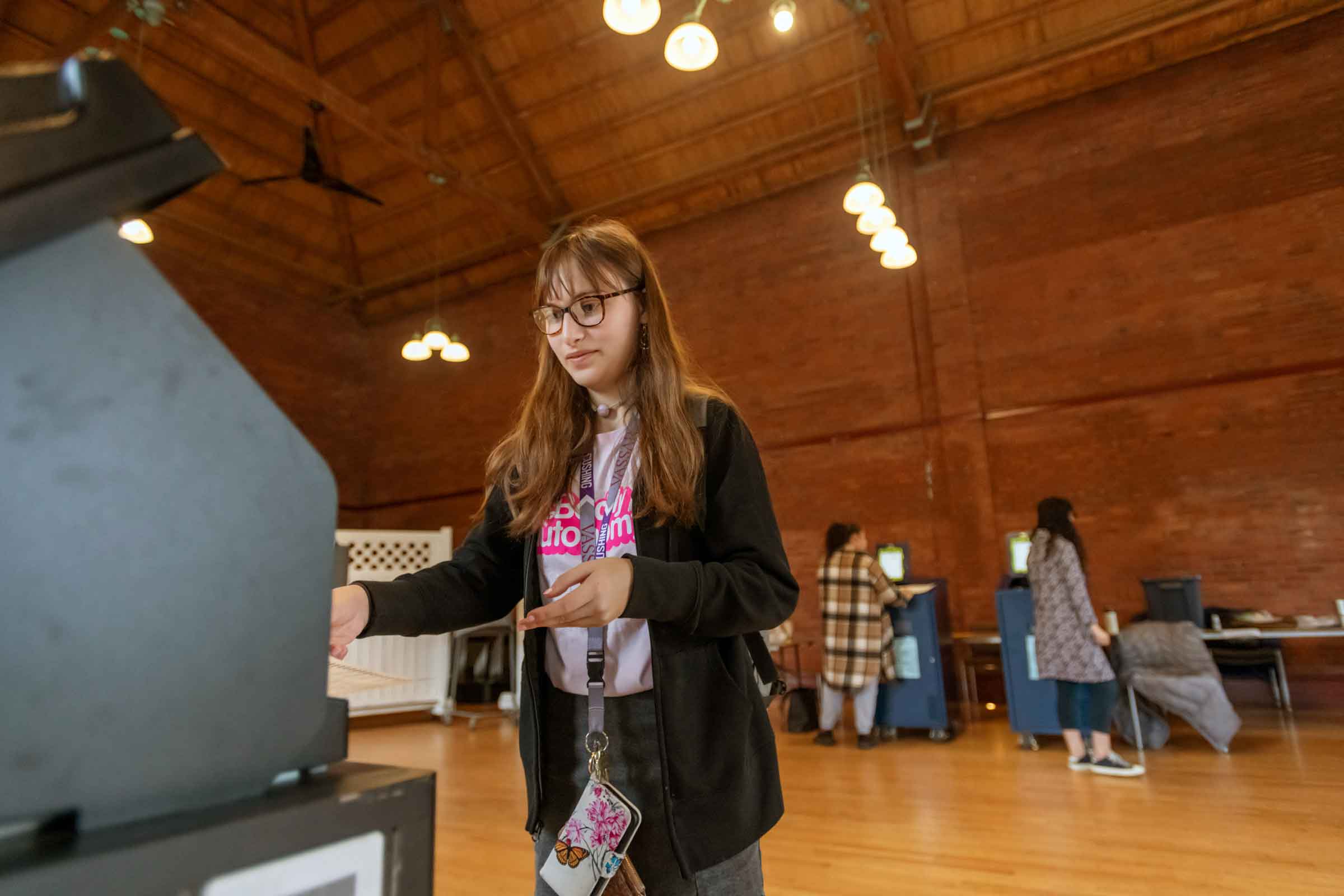 Person casting their ballot at a polling site