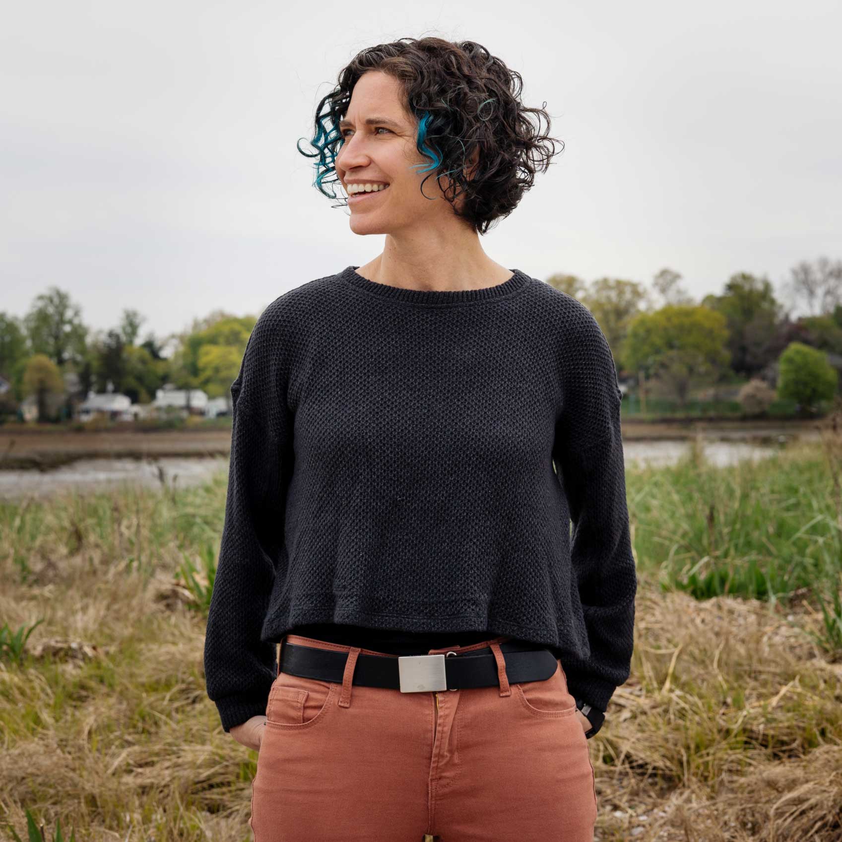 Mary Jane Rubenstein standing in a field.