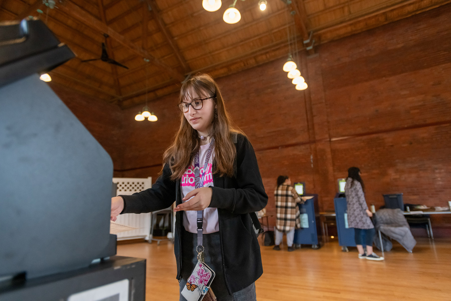 Person casting their ballot at a polling site.