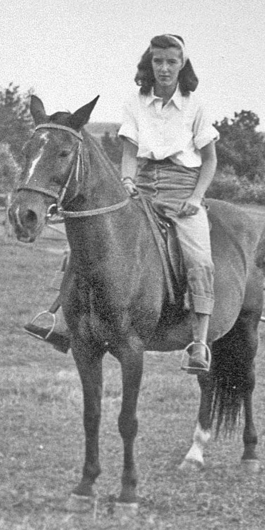 A black and white photo of Jan Farrington ’46 as a youth riding a horse.