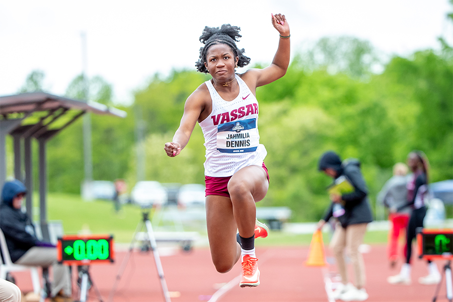 A long-jumper takes a leap during an outdoor track meet