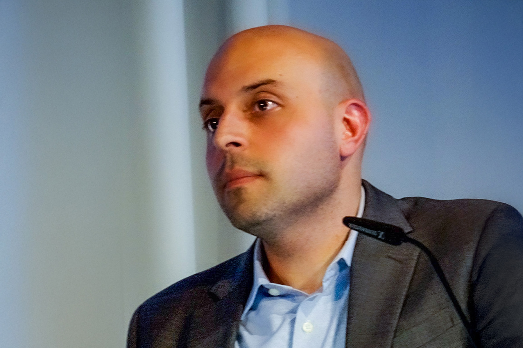 A person with a small microphone in from of them.