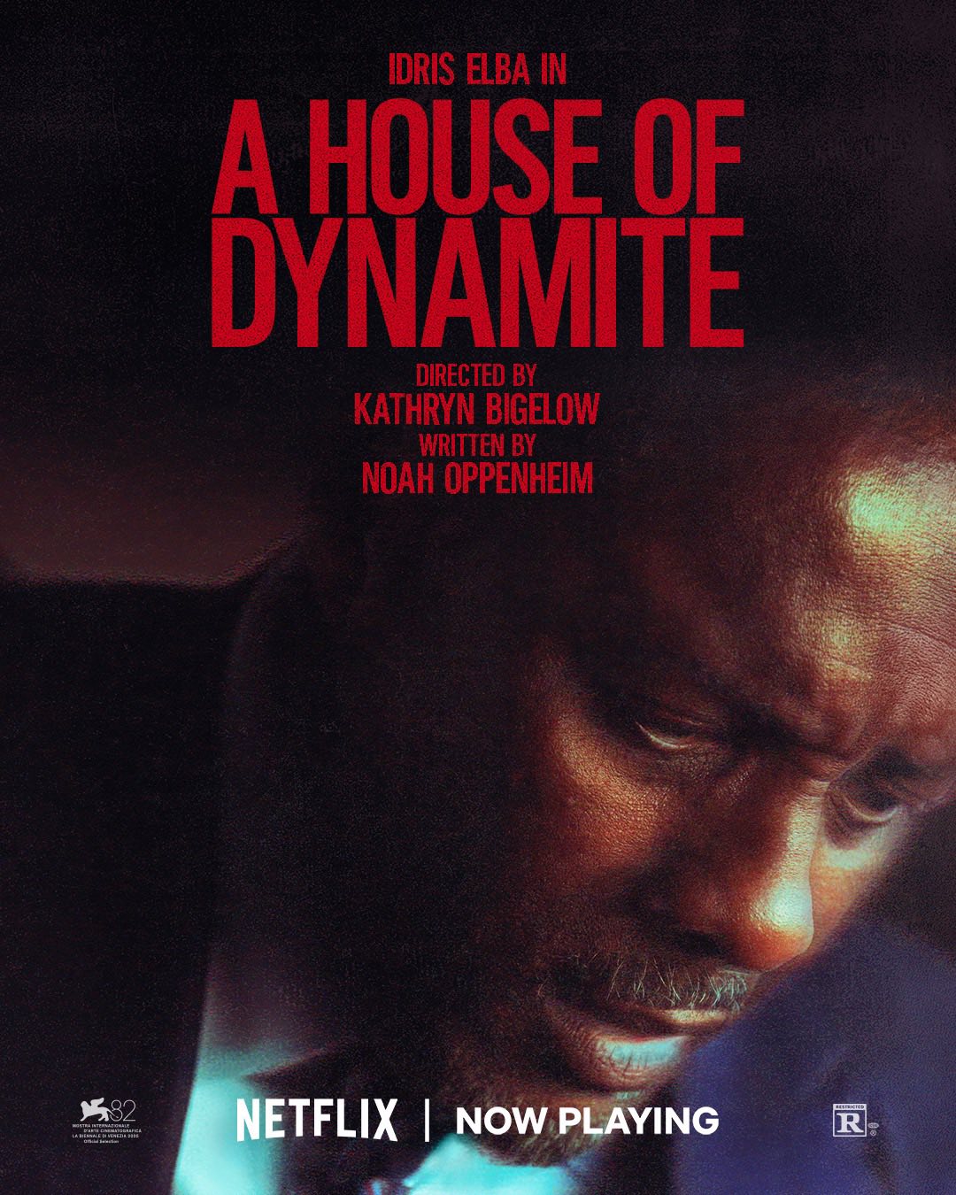 A dark, textured poster shows a somber close-up of a man lit in blue. The large red title “A House of Dynamite” dominates the top. Small text at the bottom reads “Netflix | Now Playing,” with an R rating badge.