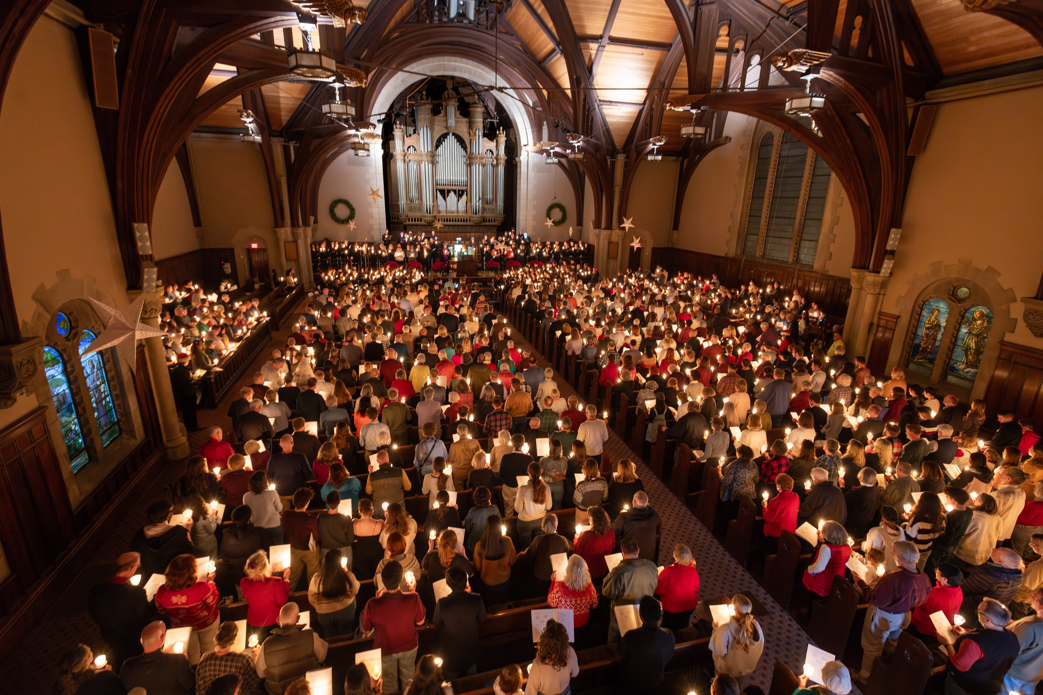 Birds eye view of a candle service in a house of worship.