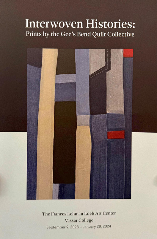 Brochure cover for “Interwoven Histories: Prints by the Gee’s Bend Quilt Collective” at the Frances Lehman Loeb Art Center, Vassar College, September 9, 2023–January 28, 2024. The design features an abstract quilt-inspired composition of vertical and rectangular fabric-like blocks in muted blues, grays, beige, black, and small accents of red.