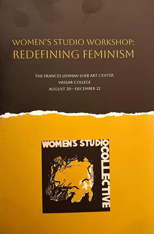 Brochure cover for “Women’s Studio Workshop Redefining Feminism” at the Frances Lehman Loeb Art Center, Vassar College, August 20–December 22. The design features gold text on a dark brown background above a torn-paper edge revealing a yellow field with a small “Women’s Studio Collective” graphic.
