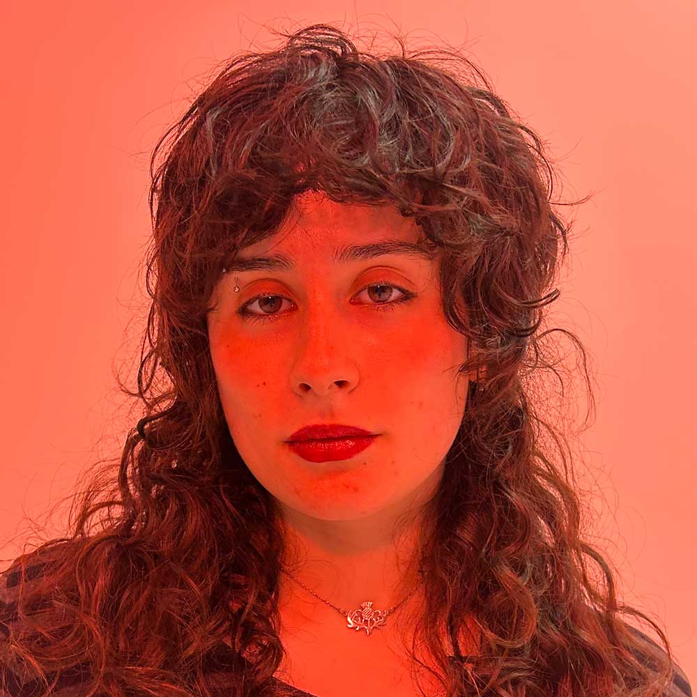 Headshot of Zola Ross Gray.