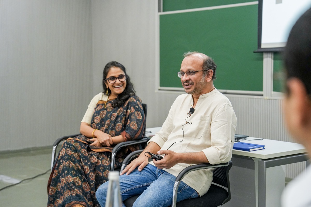 People engage in discussion in a conference room.