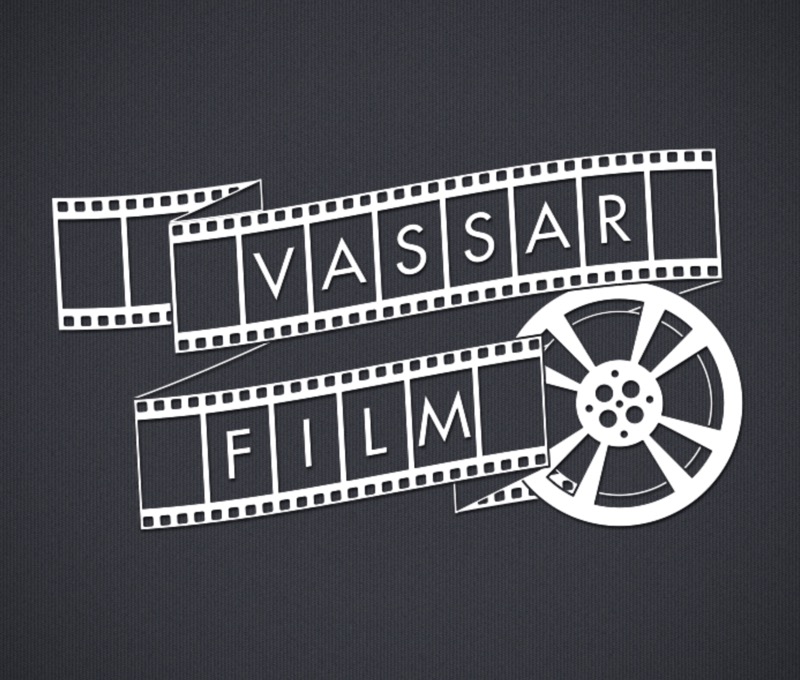 A dark gray background features white film strip elements curling around the words "Vassar" and "Film." The film strips have alternating solid and perforated sections, creating a dynamic visual flow. To the right, a stylized film reel adds detail, showcasing circular motifs with inner spokes. The overall composition emphasizes a classic cinematic theme, with balanced lettering and shapes that evoke the film industry.