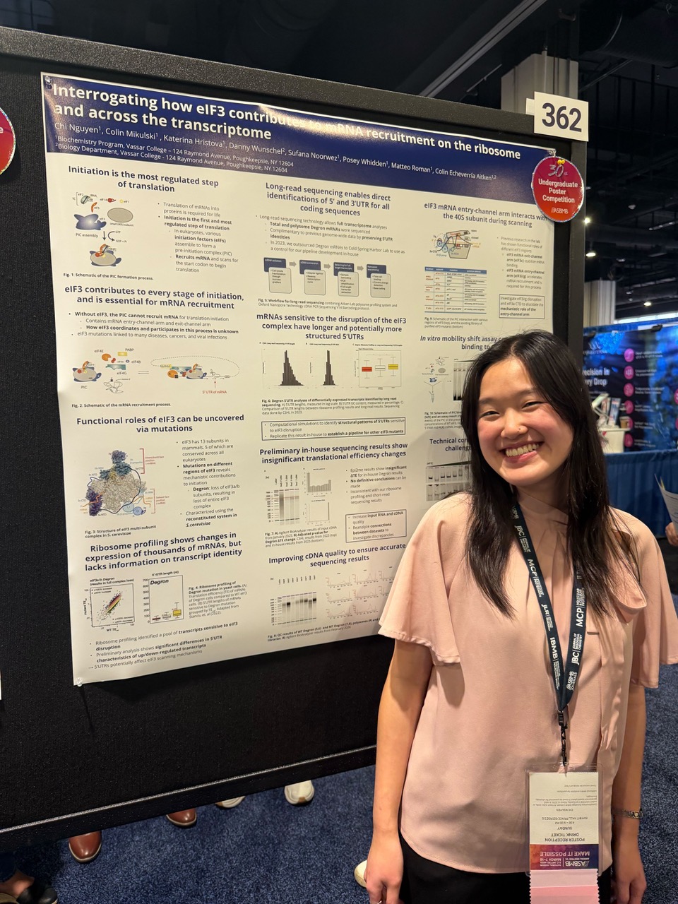 Woman standing in front of science poster.aa