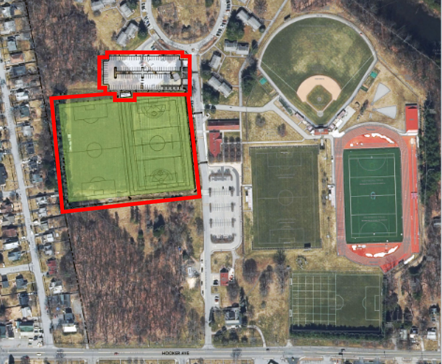 Aerial view showing the orientation of new sports fields and a parking lot, outlined and superimposed over the existing layout.