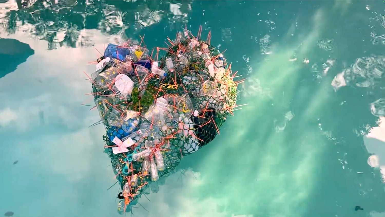 Heart Shaped artwork floating in a pool.