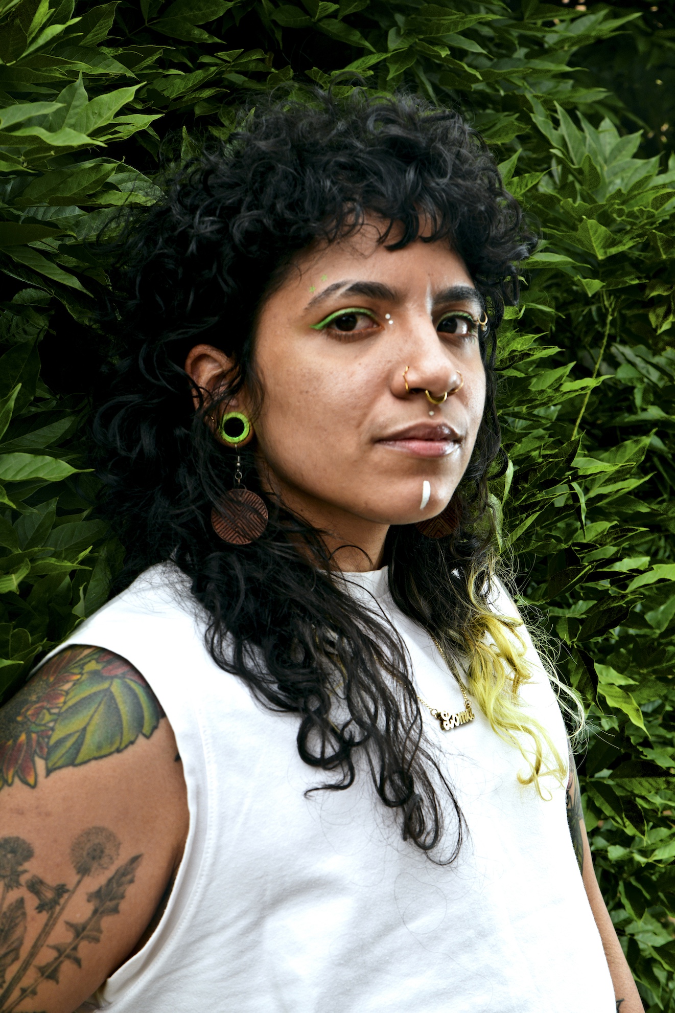 Portrait of Juliany “Loma” Taveras ’16 with indigenous face paint.