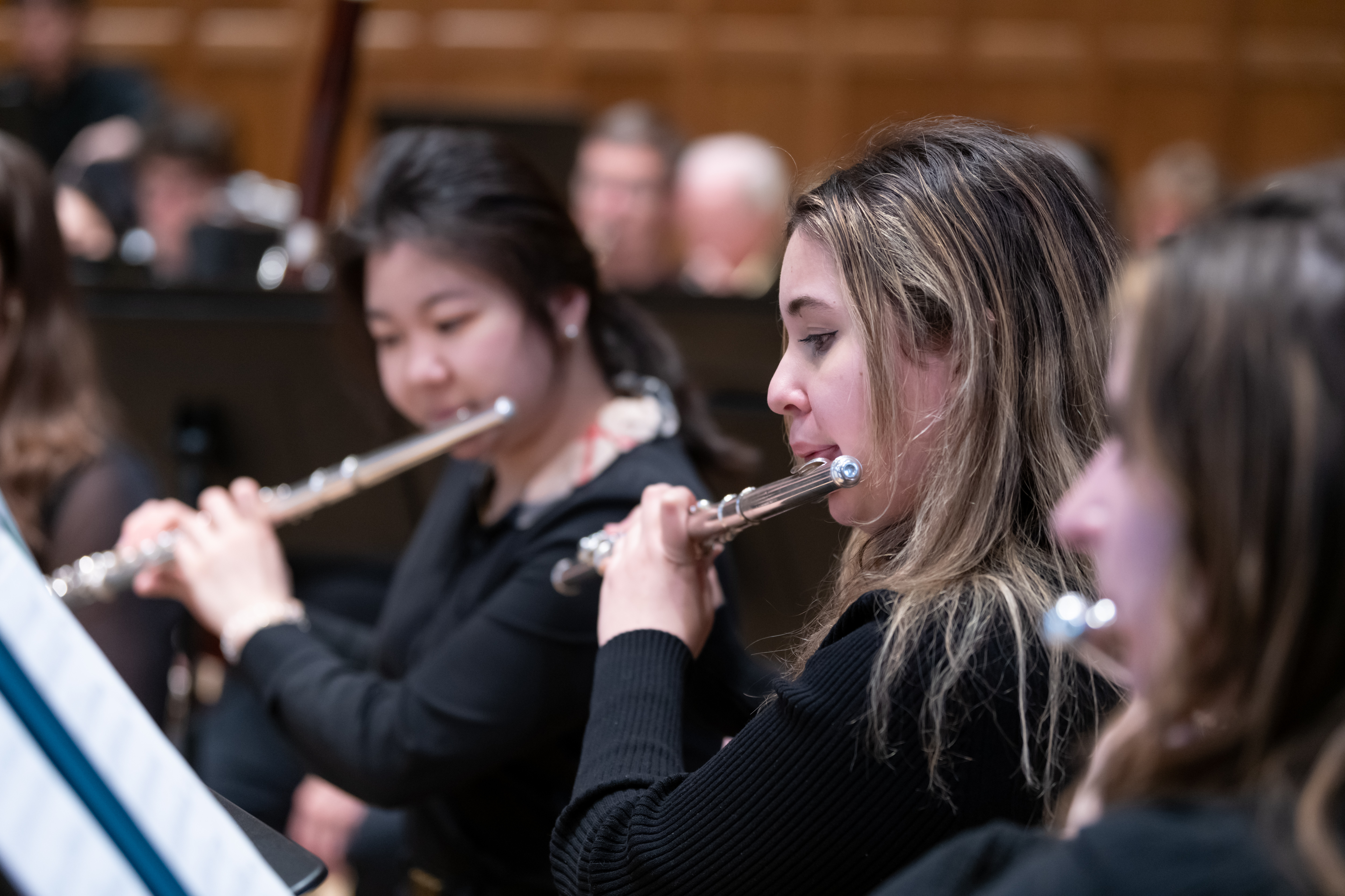 Student flutists perform with the Vassar College Wind Ensemble.