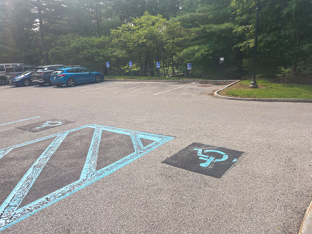 Parking lot with six accessible parking spaces.