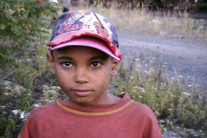 Child in a baseball cap.