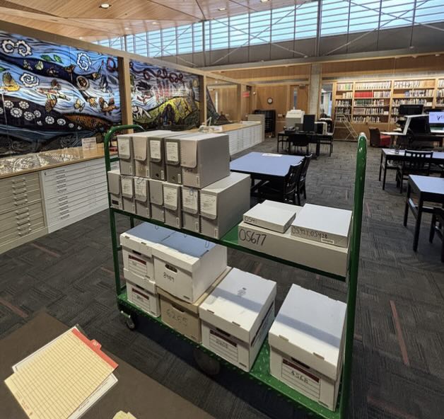 Archives boxes on a shelf.