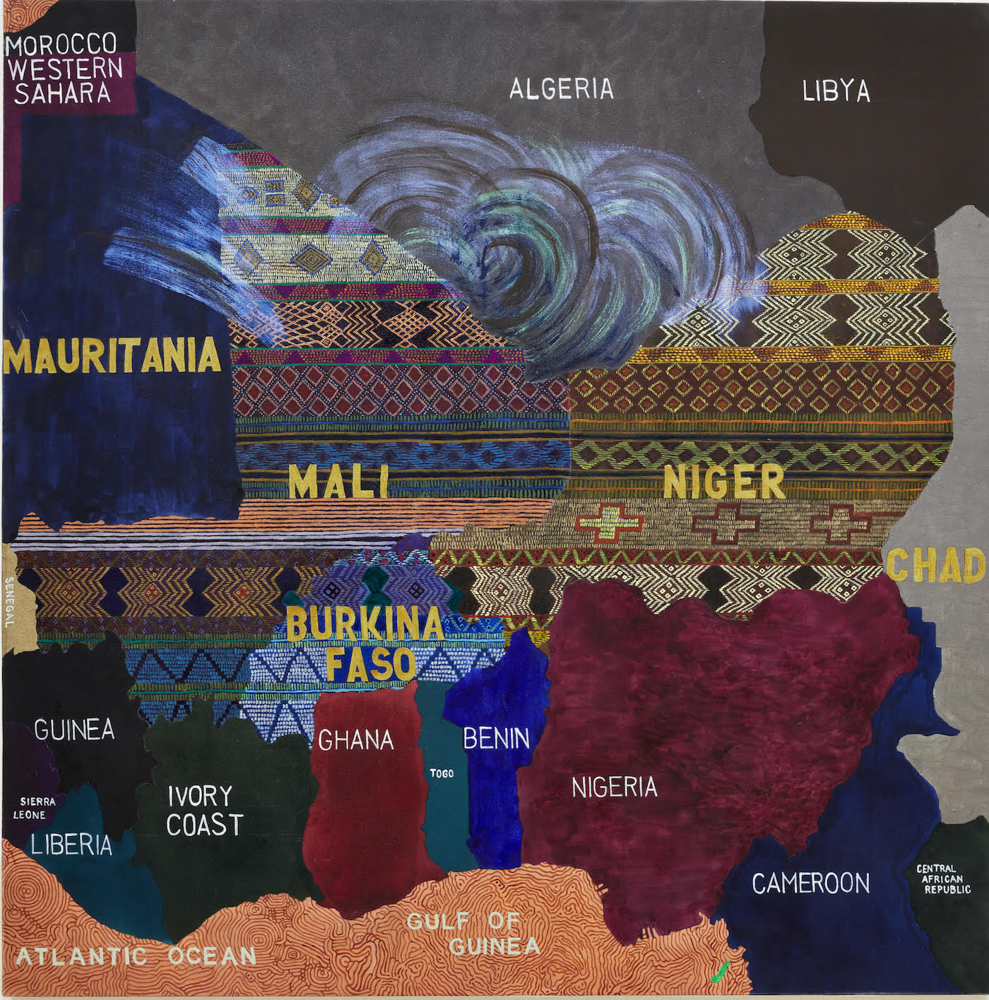 Photo of a quilt that is also a map with countries and borders.