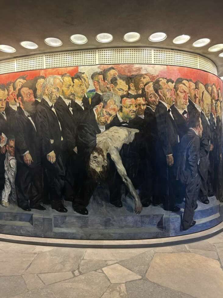 Mural of people walking in a group.