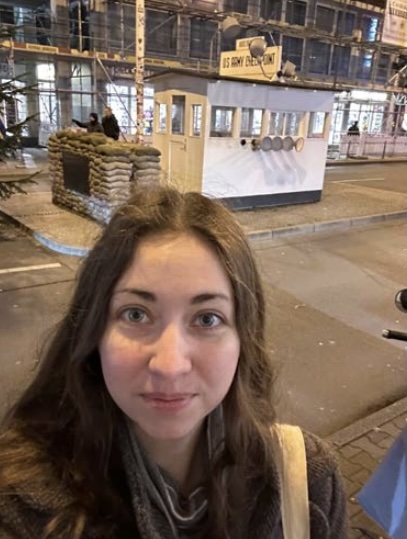 Selfie of a person on a city block.
