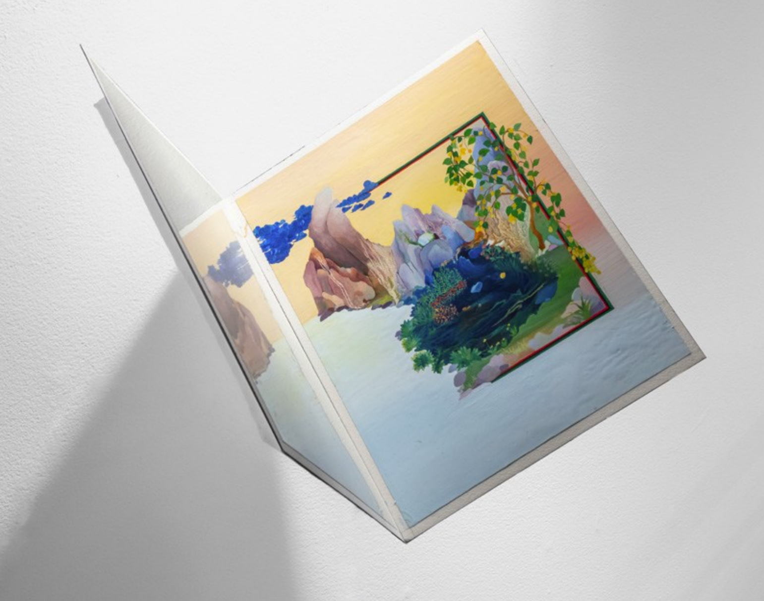 Two angled painted panels depicting a colorful landscape with rocky peaks, blue water, and trailing green foliage beneath a yellow sky.