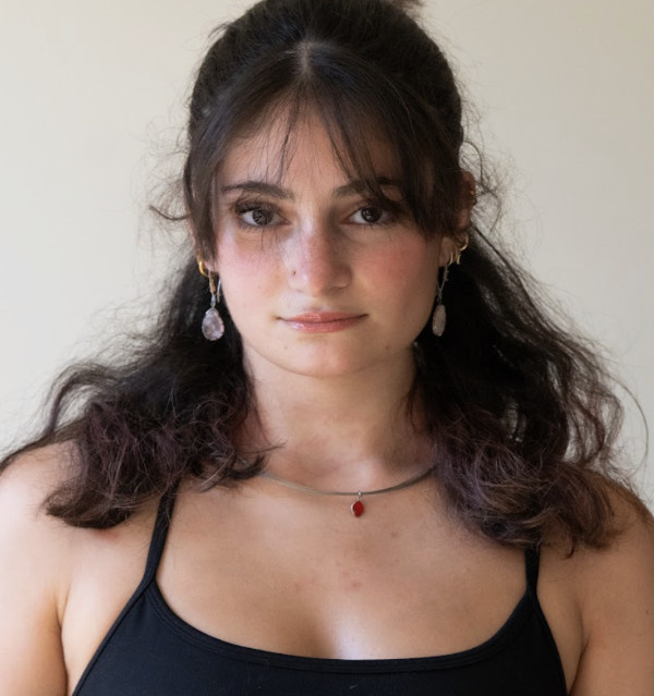 A photo of Madeline Bontempo, a person with long dark hair and a black tank top.