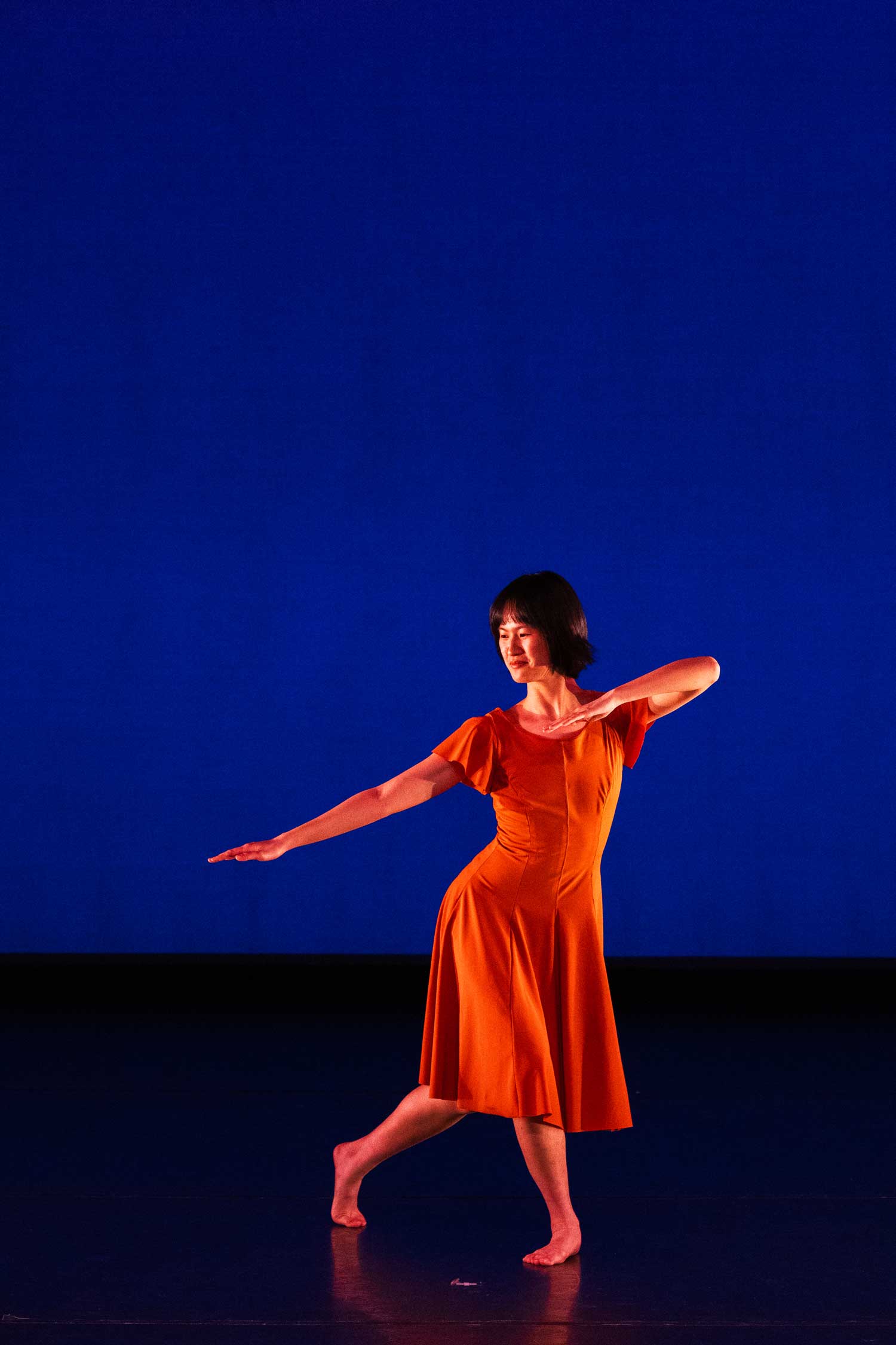 Person on a stage dancing.