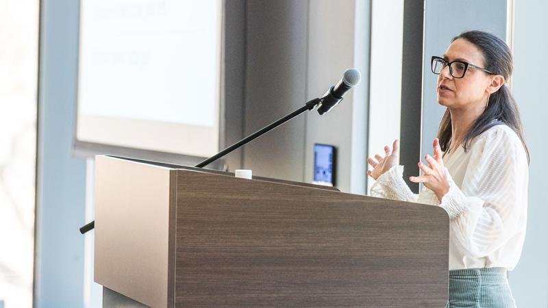 Subject speaking from a podium.