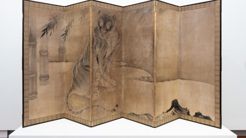 Tiger painted in ink on paper mounted on silk brocade six-fold screen.
