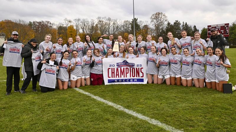A group photo of the champions taken on the field.