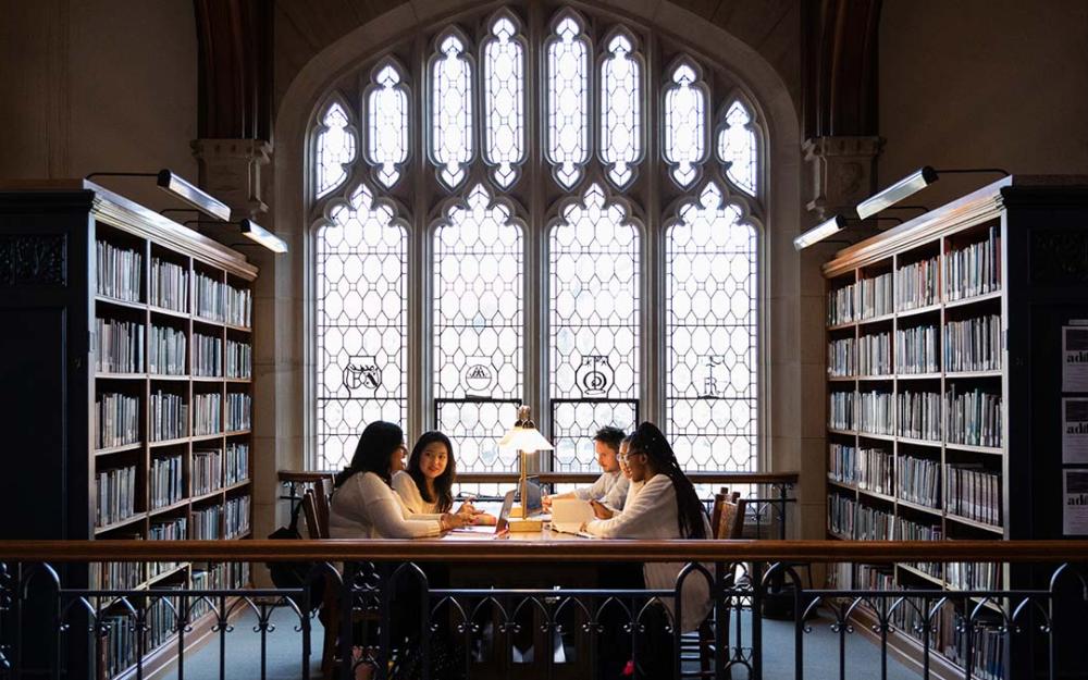 Thompson Memorial Library interior with students at a table.