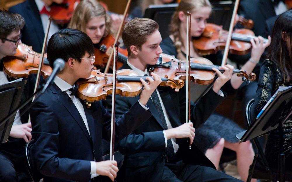 Students playing the violin in the Vassar College Orchestra