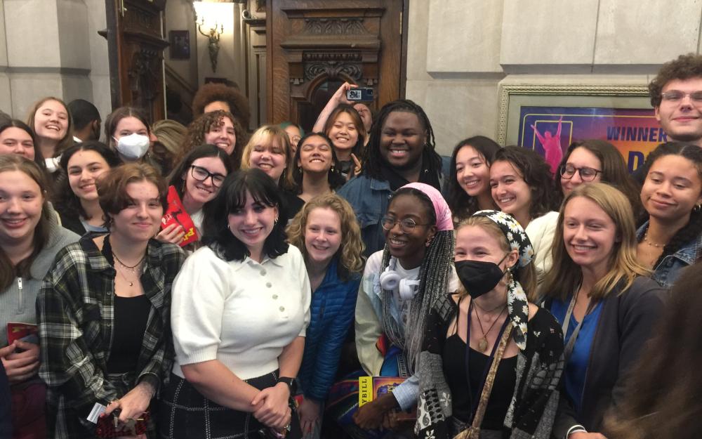 Large group of people smiling for a photo.