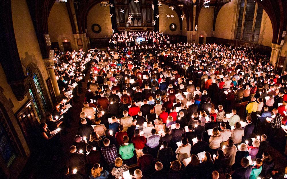 Pictured from above, the interior of the Vassar chapel with people sitting.
