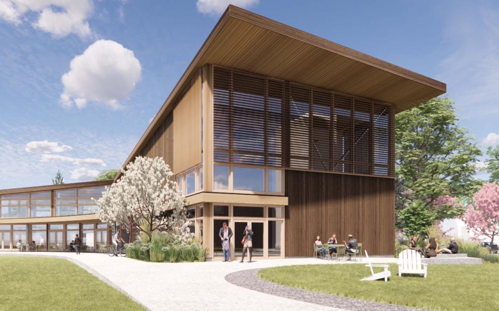 Architectural rendering of a modern wood-clad building with large windows and a slatted upper facade, set in a landscaped area with trees, pathways, and people sitting and walking outside under a blue sky.