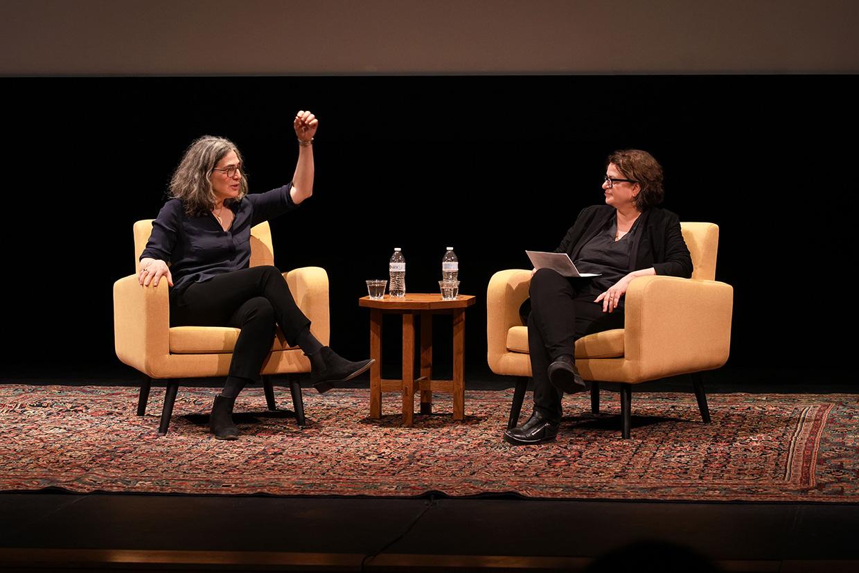 The subjects on stage, seated and in conversation