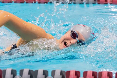 Closeup action shot of Addie Weiner swimming in a race