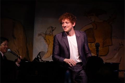 Ethan Slater onstage during a one-man performance of songs.