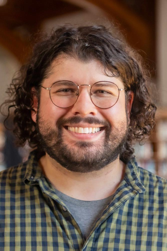 A headshot portrait of Seth Cosimini.