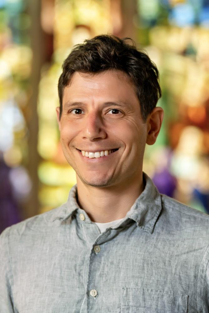 A photo of Jonah Rowen, a person with short brown hair and a gray shirt.