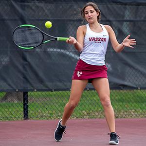 action shot of Vassar tennis player Melina Stavropoulos ’22