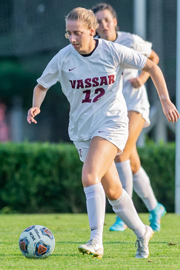 Claire Karlin dribbles the ball during a game.