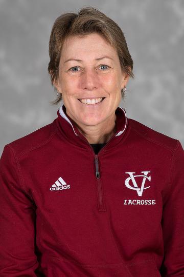 Portrait of a person smiling in a maroon pullover with Vassar imprinted on it.