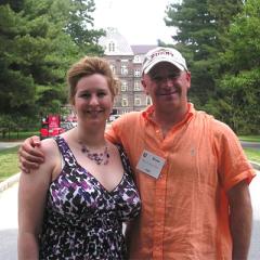 Bruce Mendelsohn stands outside of Main Building with his arm around Heather Ann Thompson. 