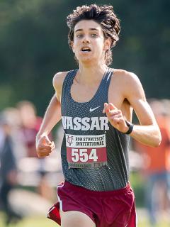 Closeup of Miles Takiguchi ’23 running in a race.