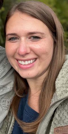 Anne Marie Wyks Spiegel wearing a blue shirt and light colored jacket and has long light colored hair.
